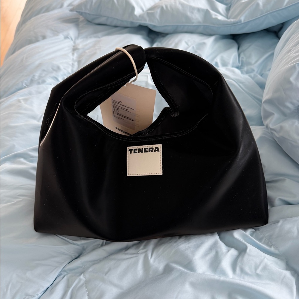 Black Shoulder Bag comes with a strap